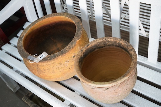 Two circular terracotta garden planters, larger width 38cm, height 23cm